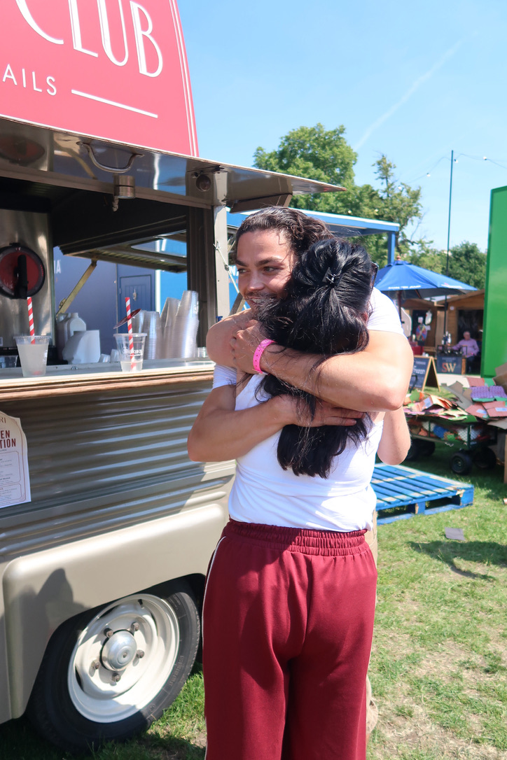 Guests hugging in front of the Daiquiri Club van