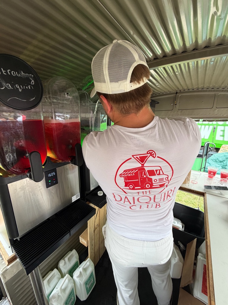 Bartender inside the van by the frozen daiquiri machines